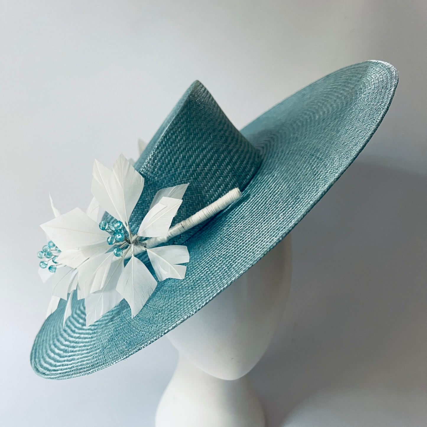 blue straw hat with flower trim