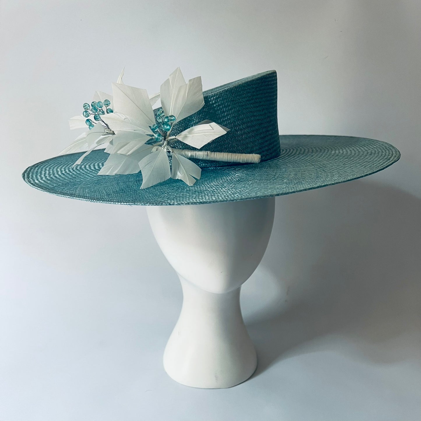 blue straw hat with flower trim