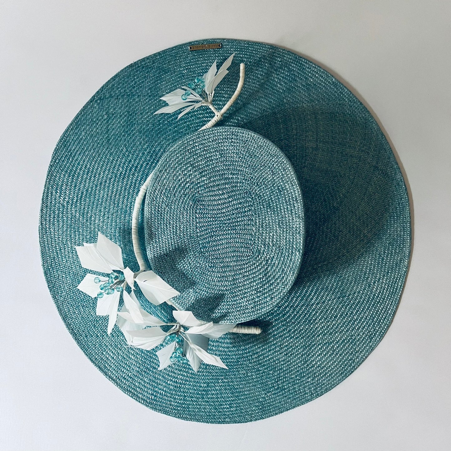blue straw hat with flower trim