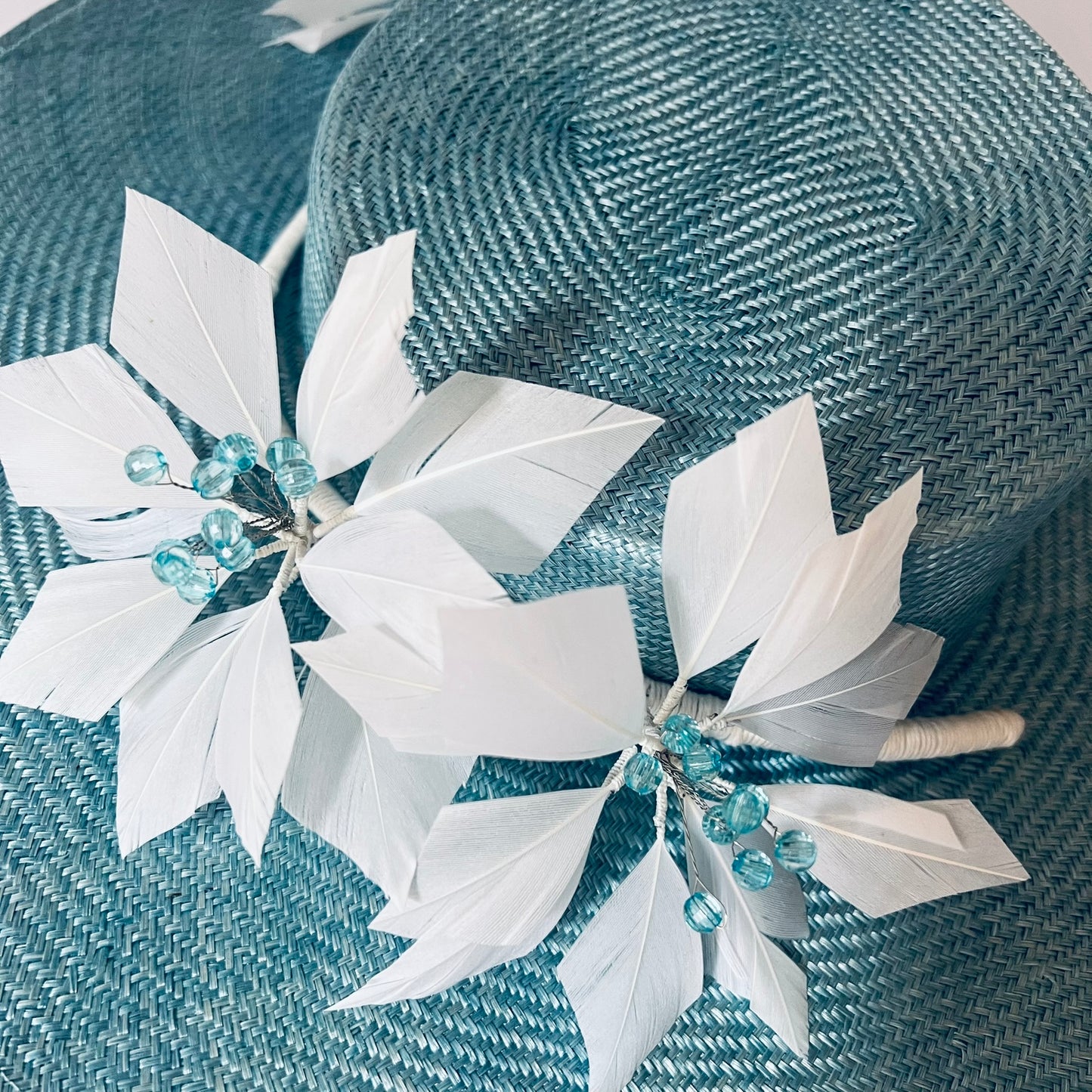 blue straw hat with flower trim