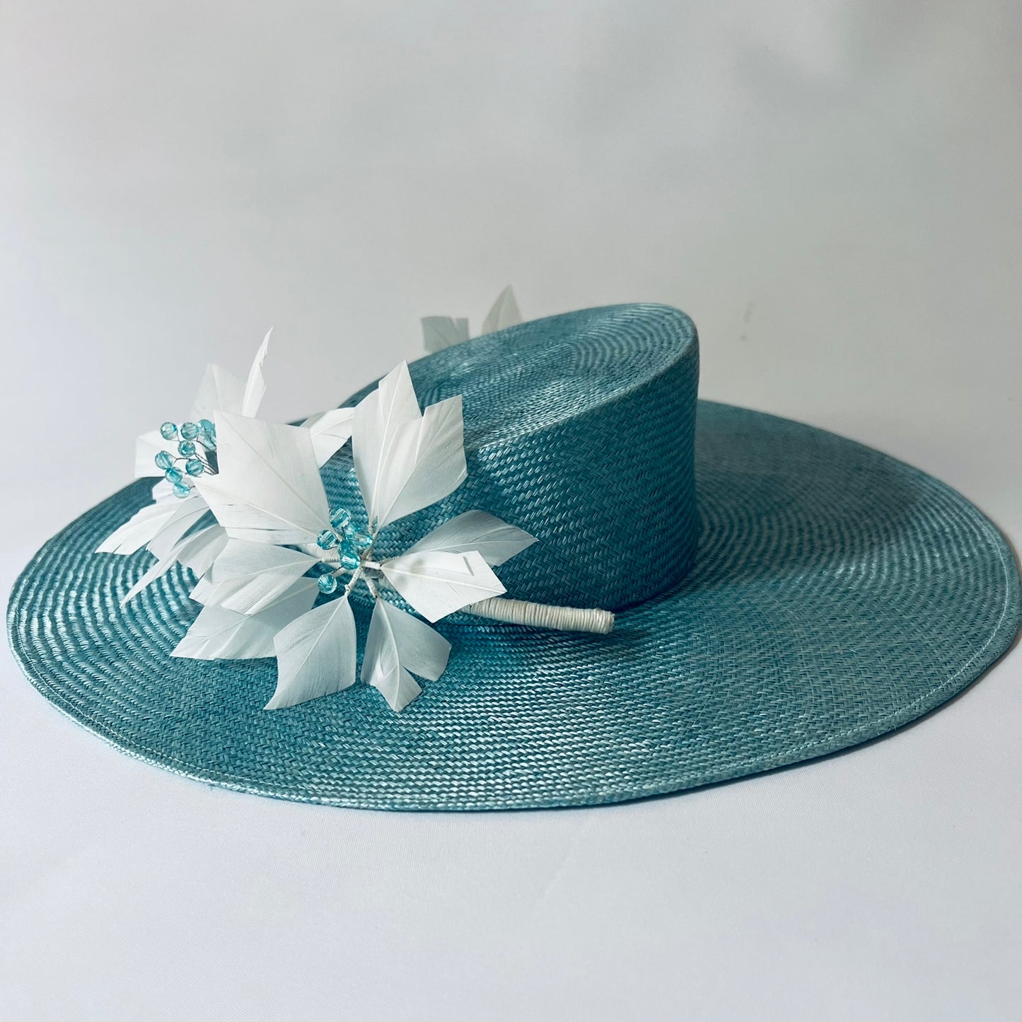 blue straw hat with flower trim