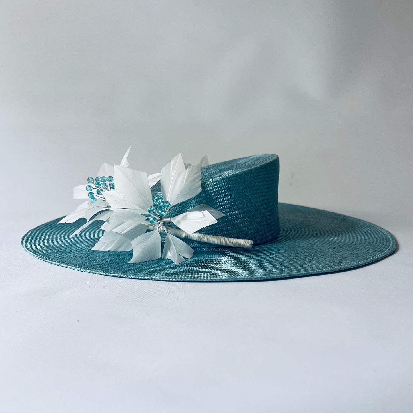 blue straw hat with flower trim