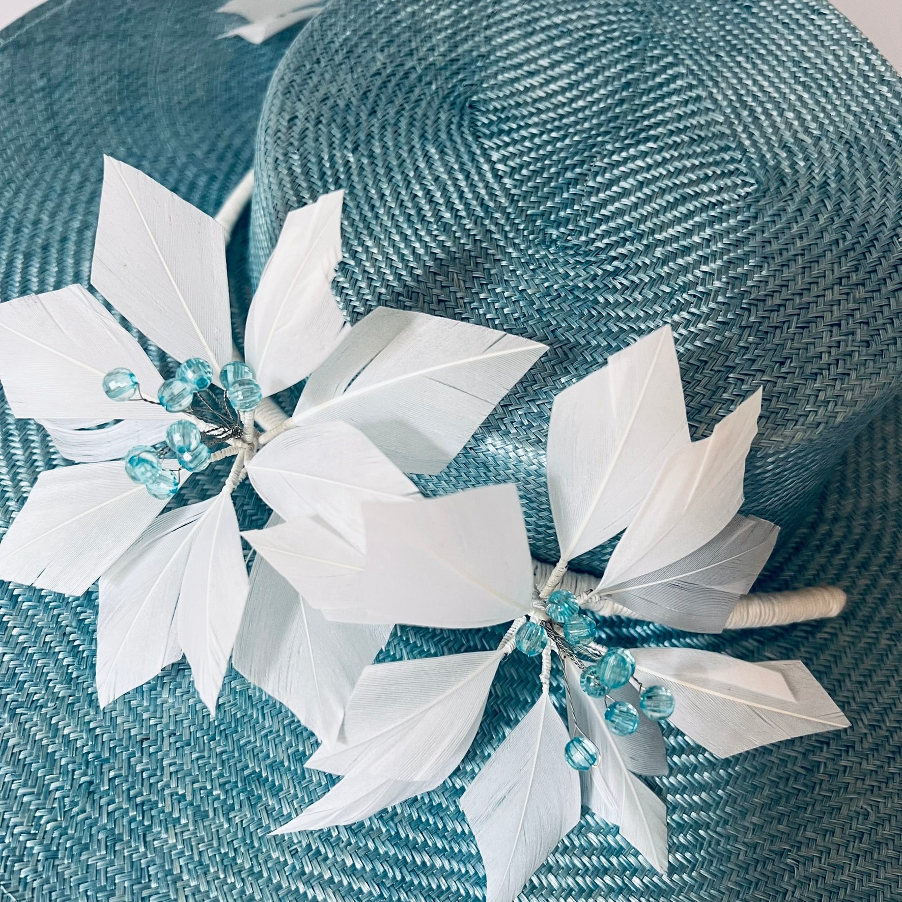 blue straw hat with flower trim