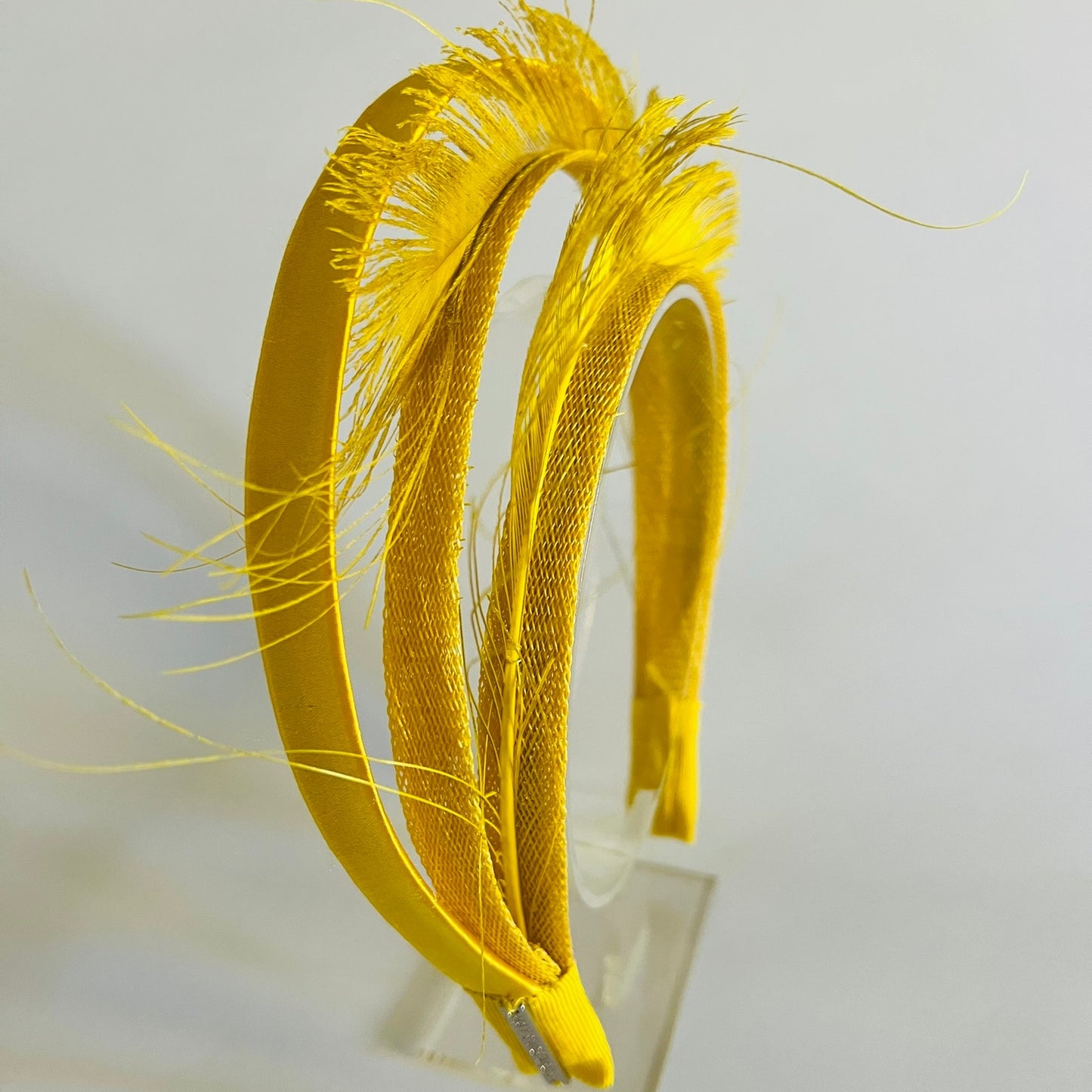  A comfortable, easy-to-wear yellow headband that adds a cheerful pop of colour to any outfit