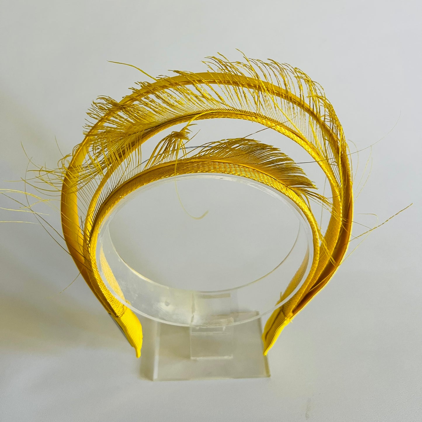  A comfortable, easy-to-wear yellow headband that adds a cheerful pop of colour to any outfit